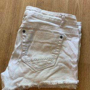 Ripped white shorts